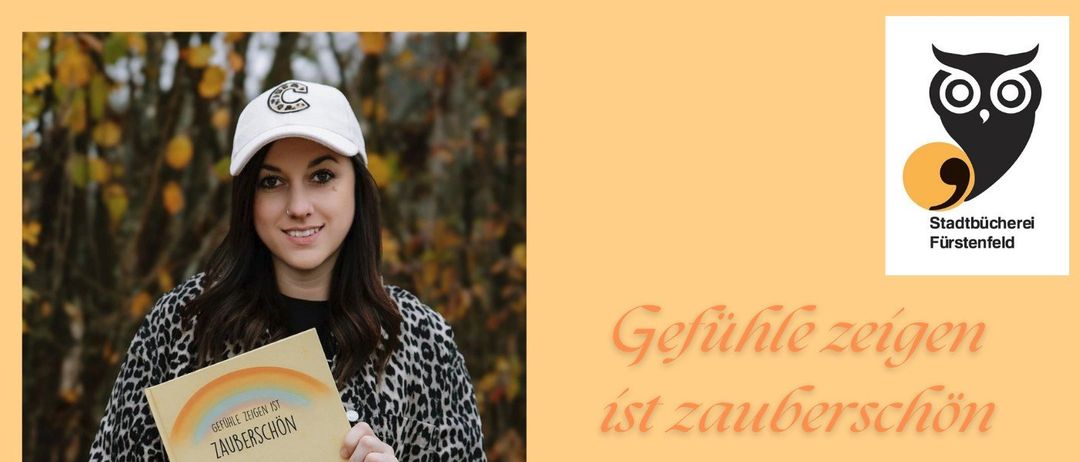 Eine Frau hält ein Buch mit dem Titel 'Zauberschön' von Carina Pirkheim, mit einer Veranstaltungsankündigung für eine Kinderbuchlesung um 16:00 Uhr am Freitag, 6. Februar 2026.