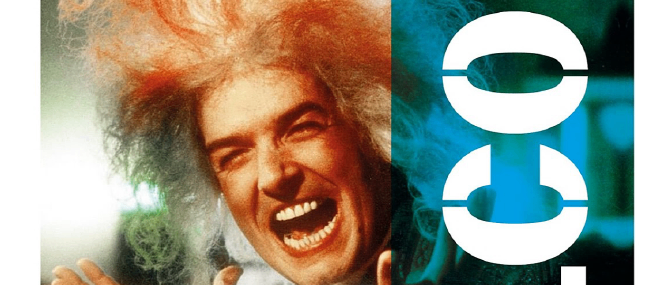 Werbeposter für Falco mit einem Mann mit wildem rotem Haar. Es steht 'Die Steiermark Premiere' und das Datum 'Sa, 21.03.2026'. Der Hintergrund ist dunkelblau und grün.