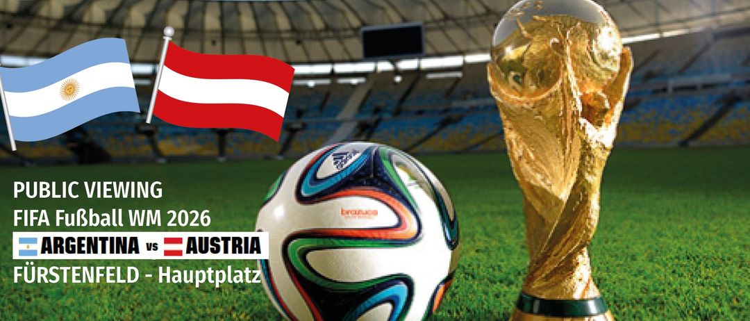 A soccer ball and a golden trophy are displayed on a field. An Austrian flag is visible in the background.