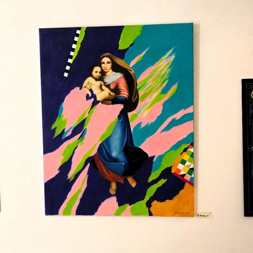 A vibrant painting depicts a woman holding a child, floating on a backdrop of abstract shapes and colors. The painting is mounted on a white wall.