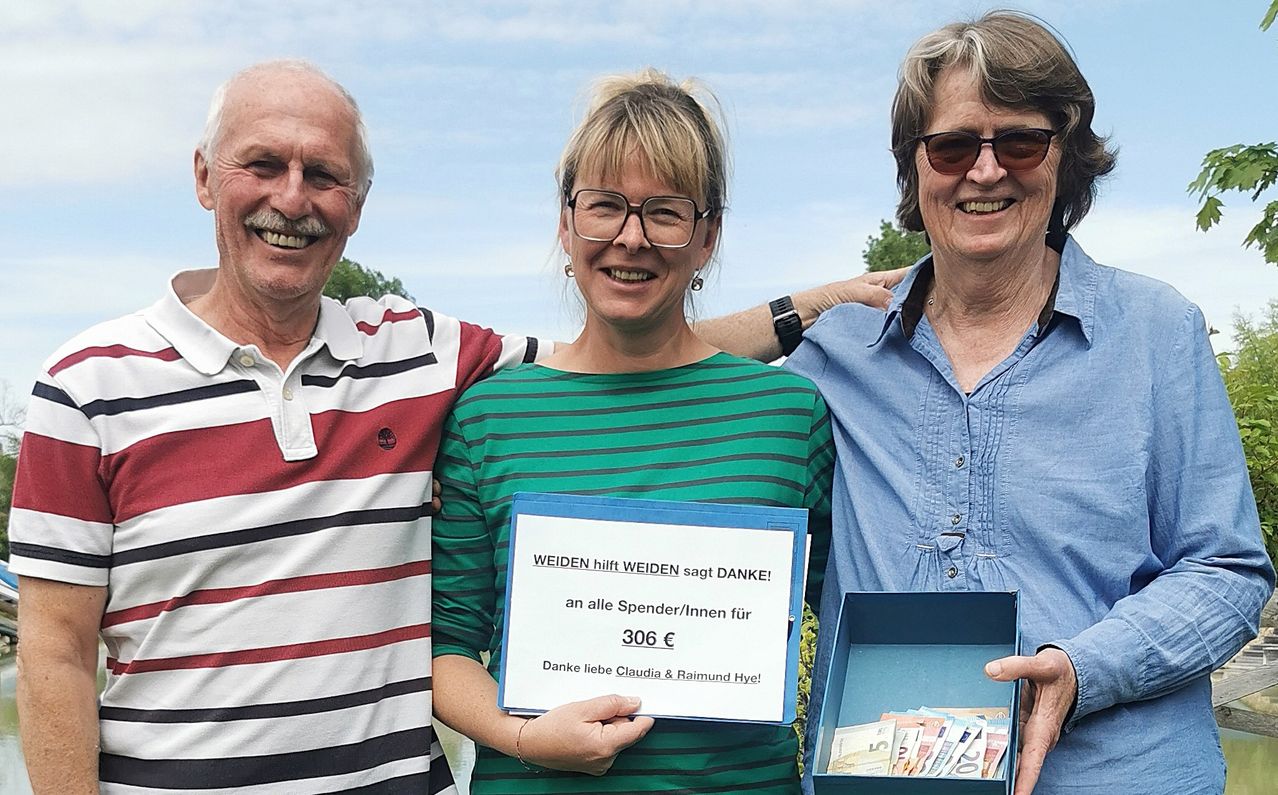 A woman holds a certificate and a box of cash, standing between two smiling individuals. The certificate says 'WEIDEN helps WEIDEN says THANK YOU!' and '306€ to all sponsors/donors for.' The box contains money.