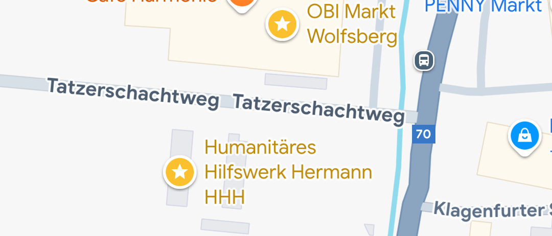 Karte zeigt Cafe Harmonie, OBI Markt, PENNY Mark und JK Sports und Fitness Wolfsburg. Symbole für Humanitäres Hilfswerk Hermann und ein Schloss sind ebenfalls zu sehen.