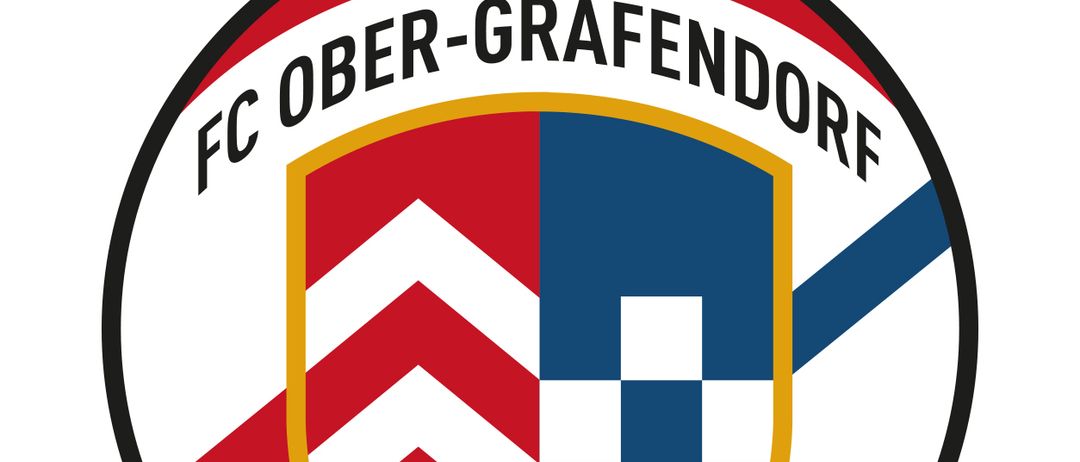 Ein Fußballteam-Logo für FC Ober-Grafendorf, das einen Schild mit rotem und blauem Hintergrund, einem weißen Diamantmuster und einem roten Dreieck auf der linken Seite zeigt.