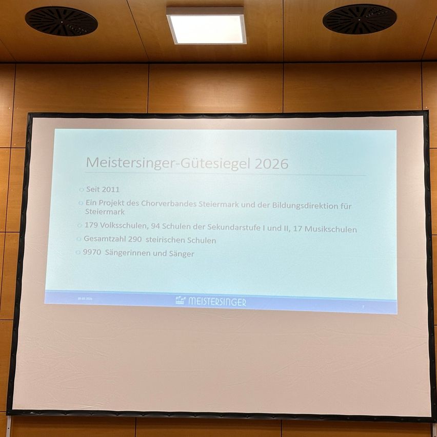 Ein Präsentationsfolie mit dem Titel 'Meistersinger-Gütesiegel 2026'. Sie enthält Daten aus dem Jahr 2011, ein Projekt des Chorverbandes Steiermark und insgesamt 290 Schulen und 9970 Sänger.