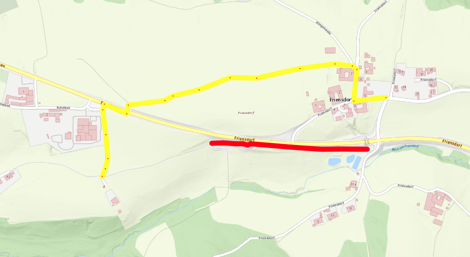 Eine Karte, die eine Route durch eine Stadt namens Friensdorf zeigt, mit einer gelben Linie, die einen Weg anzeigt, und einer roten Linie, die eine Straße anzeigt.