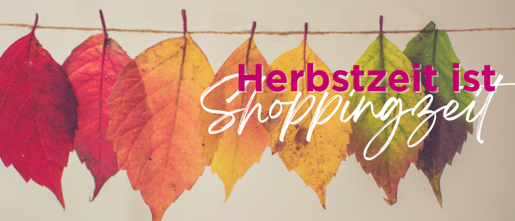 Eine Reihe bunter Herbstblätter hängt an einer Linie mit dem Text 'Herbstzeit is Shoppingzeit' in kursiver Schrift. Die Blätter reichen von rot über gelb bis grün.