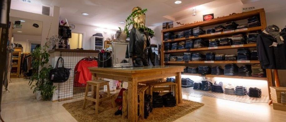 Image contains, Lighting, Indoors, Interior Design, Handbag, Floor, Flooring, Wood, Furniture, Living Room, Person