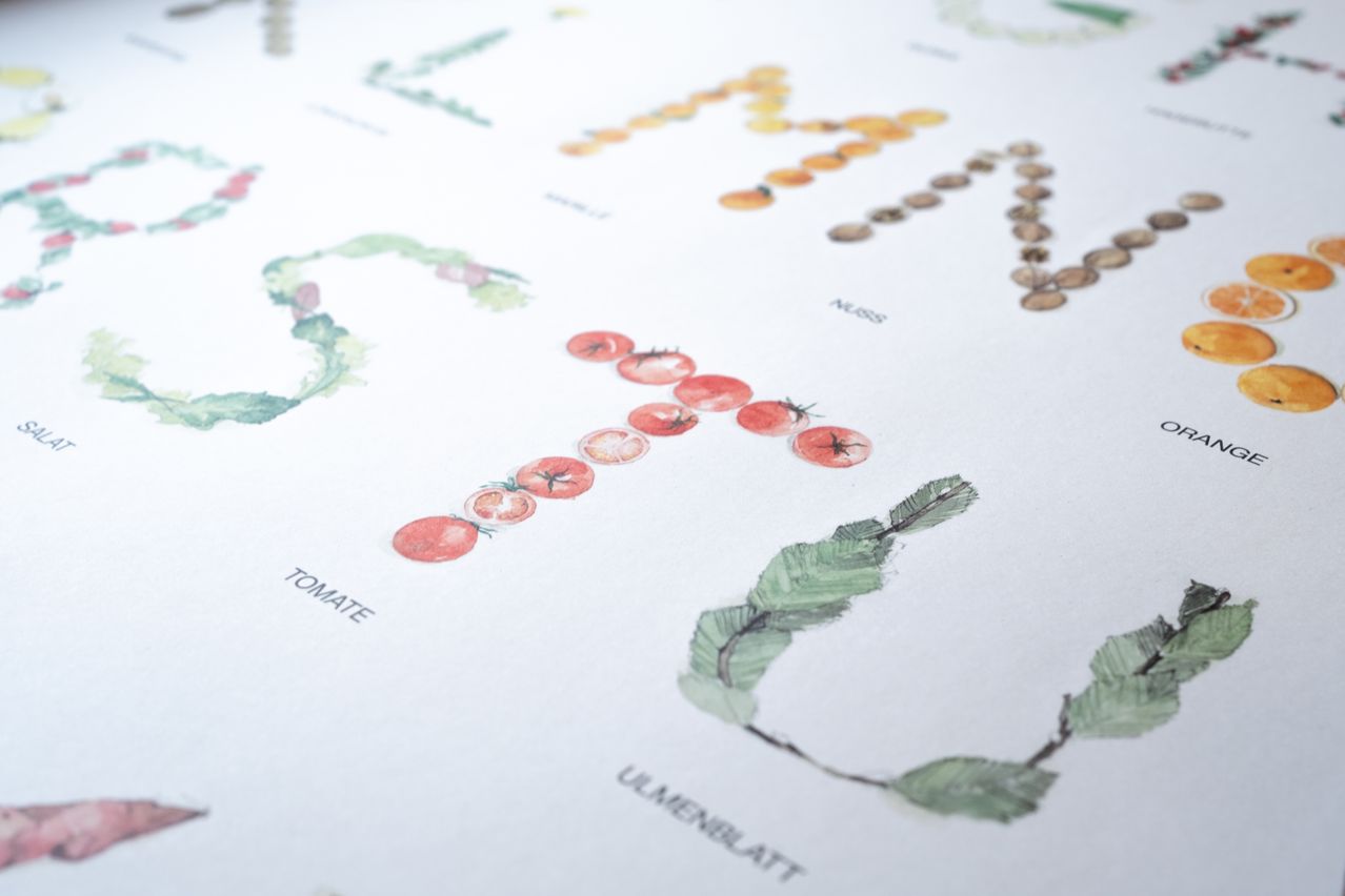 A watercolor illustration of tomatoes and leaves spells out 'TOMATO'. Various fruits and leaves are used to create the alphabet letters.