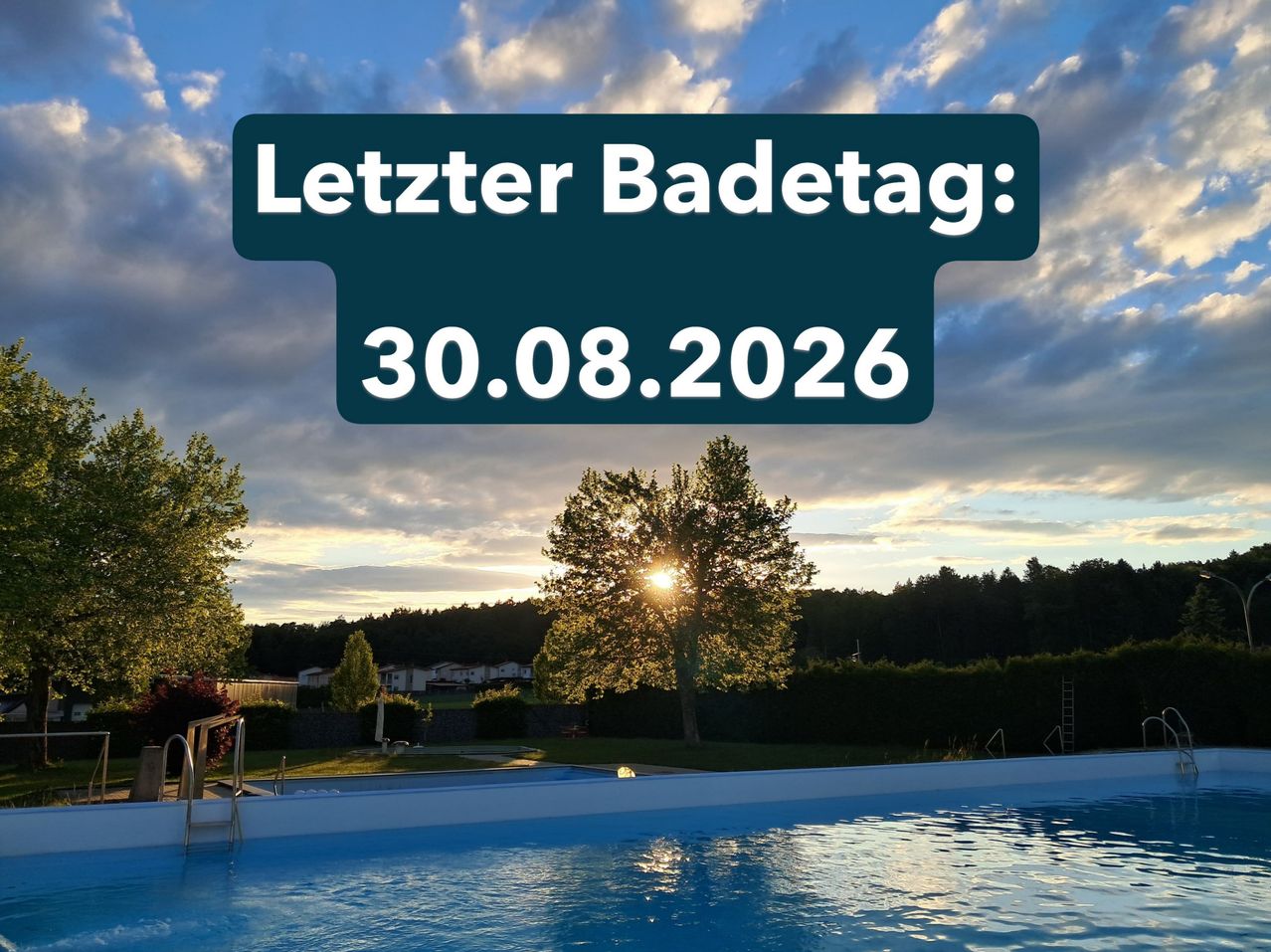 A swimming pool with a sunset in the background. A sign reads 'Letzter Badetag: 30.08.2026'.