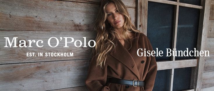 Eine Frau in einem braunen Mantel mit Gürtel steht an einer Holzwand mit dem Text 'Marc O'Polo EST. IN STOCKHOLM' und 'Gisele Bundchen' über ihr.