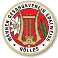 Das Bild zeigt das Logo des Manner Gesangsverein Edelweiss, das eine Harfe und eine Blume in einem Kreis darstellt, mit Sternen am Rand und dem Text 'HOLLES' darunter.