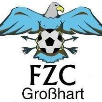 Das Logo zeigt einen blauen Adler mit ausgebreiteten Flügeln, der einen Fußball mit Pfeilen in Schwarz hält. Die Buchstaben FZC und GroBhart stehen in Schwarz unter dem Adler.