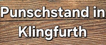 Hintergrund aus Holz mit Weihnachtsthema. Es zeigt Tannenzapfen, rote Beeren und einen Stern. Der Text lautet: 'Punschstand Klingfurth am 7. Dezember, ab 16 Uhr, am Kirchenplatz, Nikolaus, Campus, Ponybesuch.'