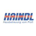 Das Bild zeigt ein Logo für HAINDLE, einen professionellen Hausbetreuungsdienst. Das Logo zeigt den Schriftzug 'HAINDLE' in fetten blauen Buchstaben mit roten Streifen über den Buchstaben. Unten steht der Text 'Hausbetreuung vom Profi' in Blau.