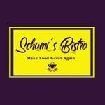 Ein gelbes Schild mit schwarzem Text sagt 'Schumi's Bistro Make Food Great Again' mit einem Tassensymbol.