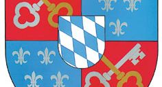 Ein heraldischer Schild mit einem blau-weißen Schachbrettmuster in der Mitte, flankiert von goldenen Schlüsseln auf beiden Seiten. Der Schild ist in vier Abschnitte unterteilt, wobei die oberen und unteren Abschnitte rot und die linken und rechten Abschnitte blau sind. Jeder Abschnitt enthält ein Fleur-de-Lis-Symbol.