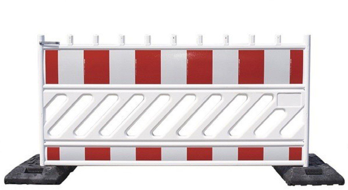 A white and red barricade with alternating vertical stripes and multiple horizontal bars, designed for roadwork or event barriers.