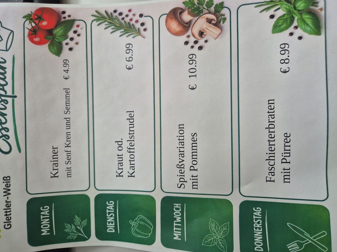 Menu card with different food options for various days, featuring items like Krainer with mustard and breadcrumbs for €4.99, Kraut od Kartoffelstrudel for €6.99, and more.