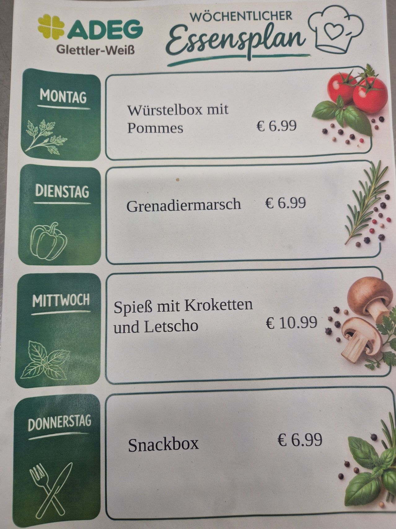 Ein Menü mit vier Tagesspezialitäten. Montag: Wurstelbox mit Pommes für 6,99 Euro. Dienstag: Grenadiermarsch für 6,99 Euro. Mittwoch: Spies mit Kroketten und Letscho für 10,99 Euro. Donnerstag: Snackbox für 6,99 Euro.
