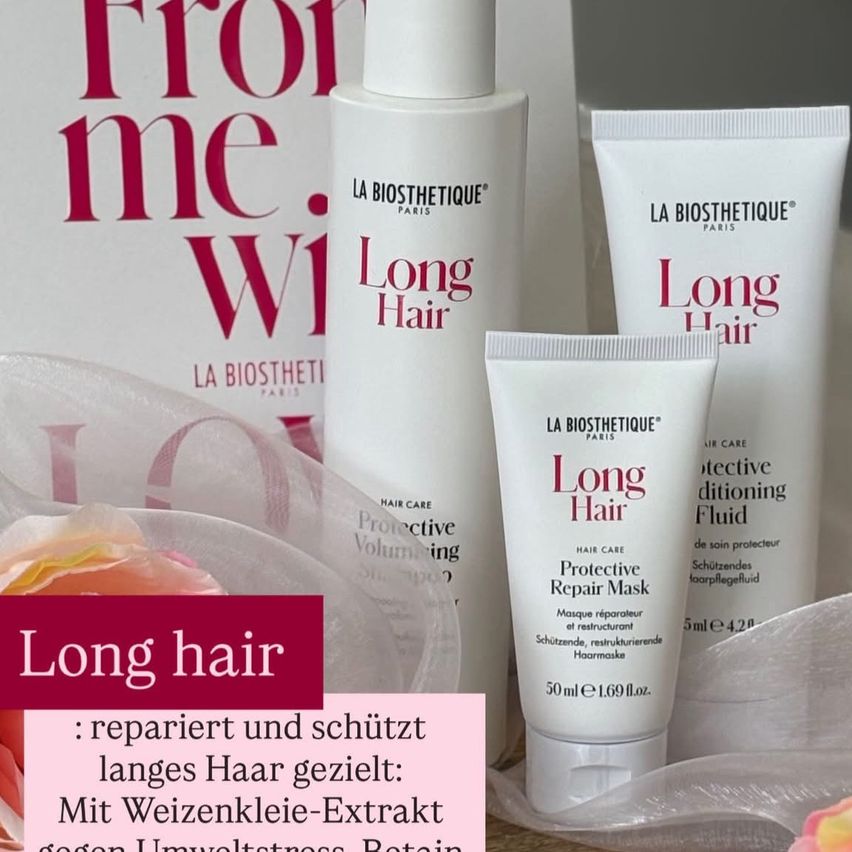 Ein Set von Haarpflegeprodukten von La Biosthetique Paris für langes Haar, einschließlich einer schützenden Reparaturmaske. Die Produkte sind in weißen Behältern mit rotem Text.