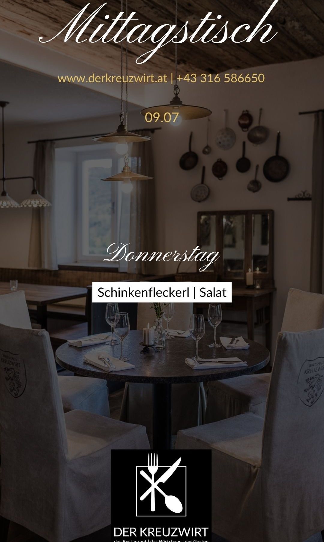 An empty dining area in a restaurant with round table, wine glasses, plates, napkins, and a sign reading 'Schinkenfleckerl | Salat'. The walls are adorned with pots and pans.