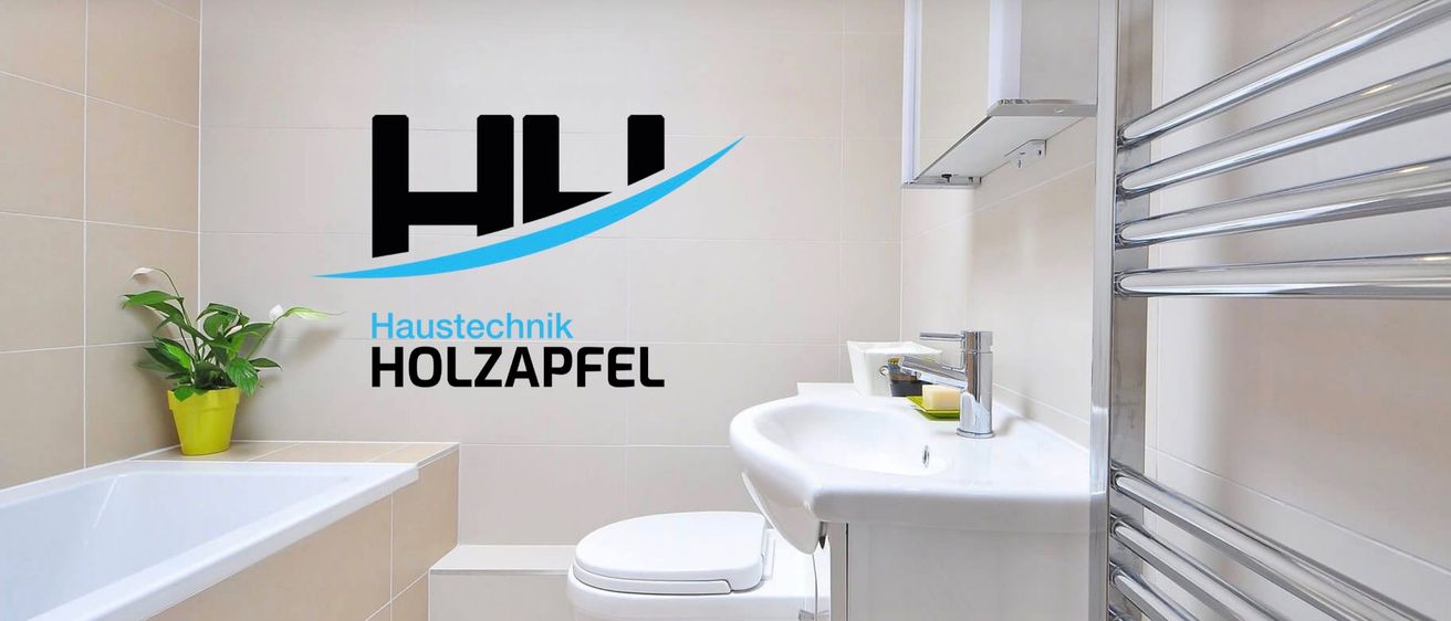 Ein Badezimmer mit weißem Waschbecken und Toilette, an der Wand ein Logo mit dem Text 'HL Technik' und 'LZAPFEL'. Eine Seife und ein Becher sind auf dem Waschtisch.