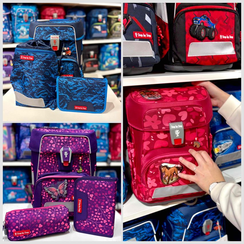 Verschiedene farbenfrohe Rucksäcke und Federmäppchen sind in einem Geschäft ausgestellt. Die Rucksäcke haben verschiedene Designs, darunter ein Monster-Truck, ein Pferd und einen Schmetterling.