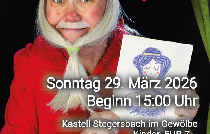 Eine ältere Frau, verkleidet als Narr, hält eine Zeichnung und ein Schild. Das Schild lautet 'Sonntag 29. März 2026, Beginn 15:00 Uhr, Kastell Stegersbach, EUR 7 für Kinder, EUR 10 für Erwachsene.' Die Frau hält die Zeichnung in der rechten Hand.