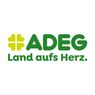 ADEG-Logo mit einem vierblättrigen Kleeblatt, der Text lautet ADEG Land aufs Herz. ADEG ist eine Supermarktkette.