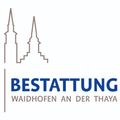 Logo für eine Zertifizierung in Waidhofen an der Thaya, mit zwei Kirchtürmen und dem Text 'Bestätigung' in Blau.