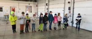 Floor, Person, Boy, Child, Male, People, Jacket, Shoe, Jeans, Indoors