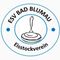 Das Bild zeigt ein Logo für 'ESV Bad Blumau Eisstockverein' mit einem stilisierten Eisschieber in der Mitte, umgeben von einem blauen Kreis.