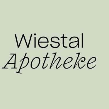 Grüner Hintergrund mit schwarzem Text, der 'Wiestal Apotheke' lautet, wobei 'Wiestal' in größerer Schrift und 'Apotheke' in kursiver Schrift geschrieben ist.