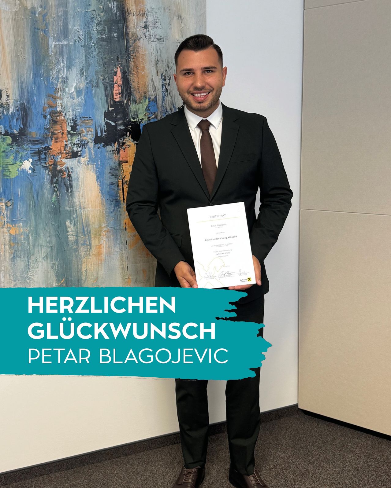 A man in a suit holds a certificate. Behind him is a colorful painting. A banner reads Herzlichen Gluckwunsch Petar Blagojevic.