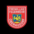 Das Emblem der Freiwilligen Feuerwehr Oberaudorf zeigt einen roten Schild mit einem blau-gelben Adlerwappen, umgeben vom Text 'Freiwillige Feuerwehr Oberaudorf'.