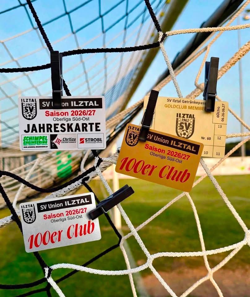 Several membership cards for the 2026/27 season of SV Union Iltztal are clipped to a soccer net. The cards are in different colors and sizes, with some featuring the logo of the club.