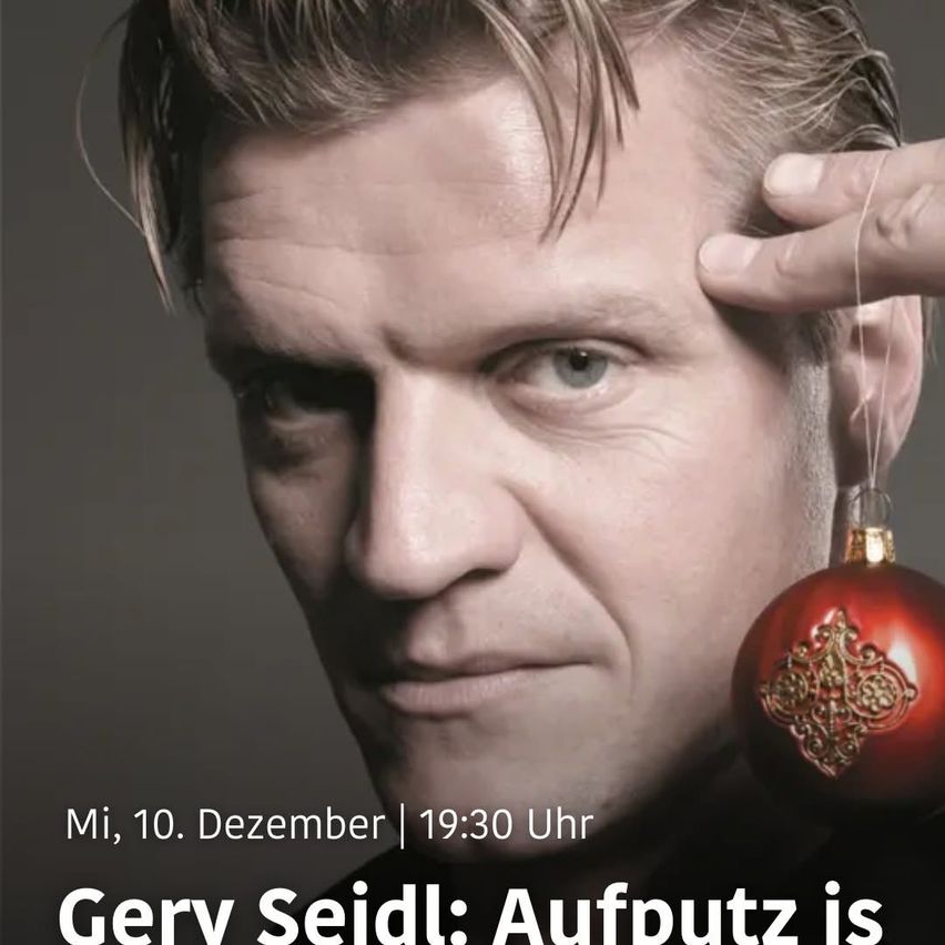 Nahaufnahme des Gesichts eines Mannes mit einem roten Ornament. Der Text lautet: 'Mi, 10. Dezember | 19:30 Uhr Gerv Seidl: Aufputz ist'.
