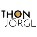 Das Logo für die Marke 'Thon Jorgl', dargestellt in Schwarz und Gold mit einem gelben Punkt in der Mitte des 'O'.