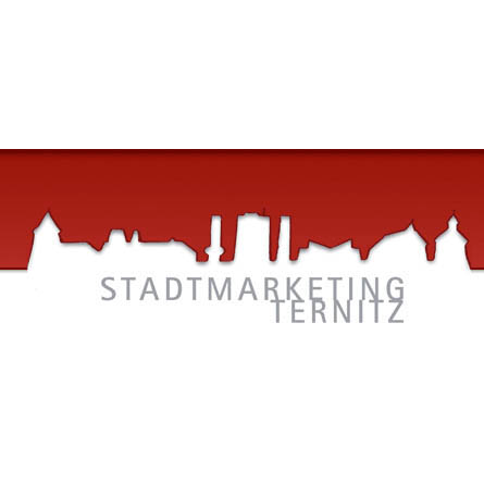 Ein roter und schwarzer Banner mit weißem Text, der 'Stadtmarketing Ternitz' über einer Skyline-Silhouette steht.
