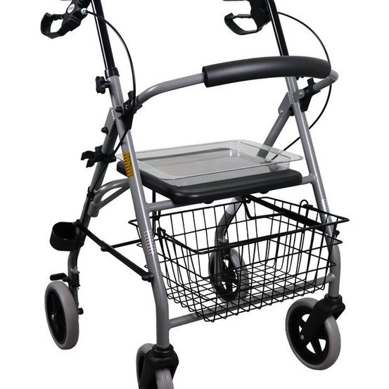 Das Bild zeigt einen grauen Rollator mit vier Rädern und einem Tablett vorne. Die Handgriffe sind verstellbar. Unter dem Tablett befindet sich ein Korb.