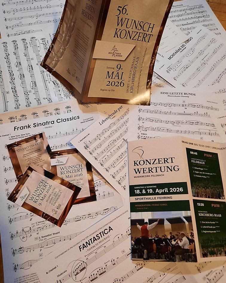 Notenblätter, Frank Sinatra Classics und Broschüren für Konzerte am 9. Mai 2026 und 18.-19. April 2026. Die Broschüren enthalten Details wie Datum, Uhrzeit und Veranstaltungsorte.