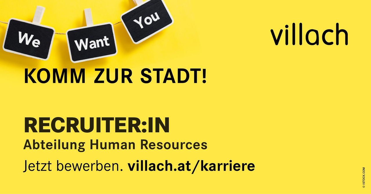 Ein leuchtend gelbes Poster mit schwarzen Schildern, die 'Du willst' und 'zur stadt!' sagen. Es enthält auch 'JOINER:IN Human Resources' und eine Website-Adresse 'leben.villach.at/karriere'.