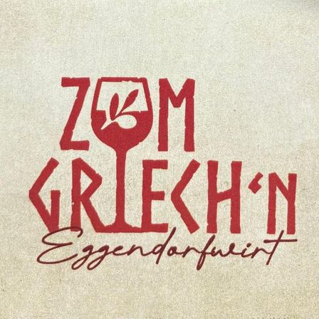 Das Bild zeigt den Schriftzug 'Zum Griechen' in rotem Schriftzug, was auf einen griechisch inspirierten Ort oder ein Restaurant hindeutet. Darunter steht 'Eggendorfwein', möglicherweise eine Weinsorte.