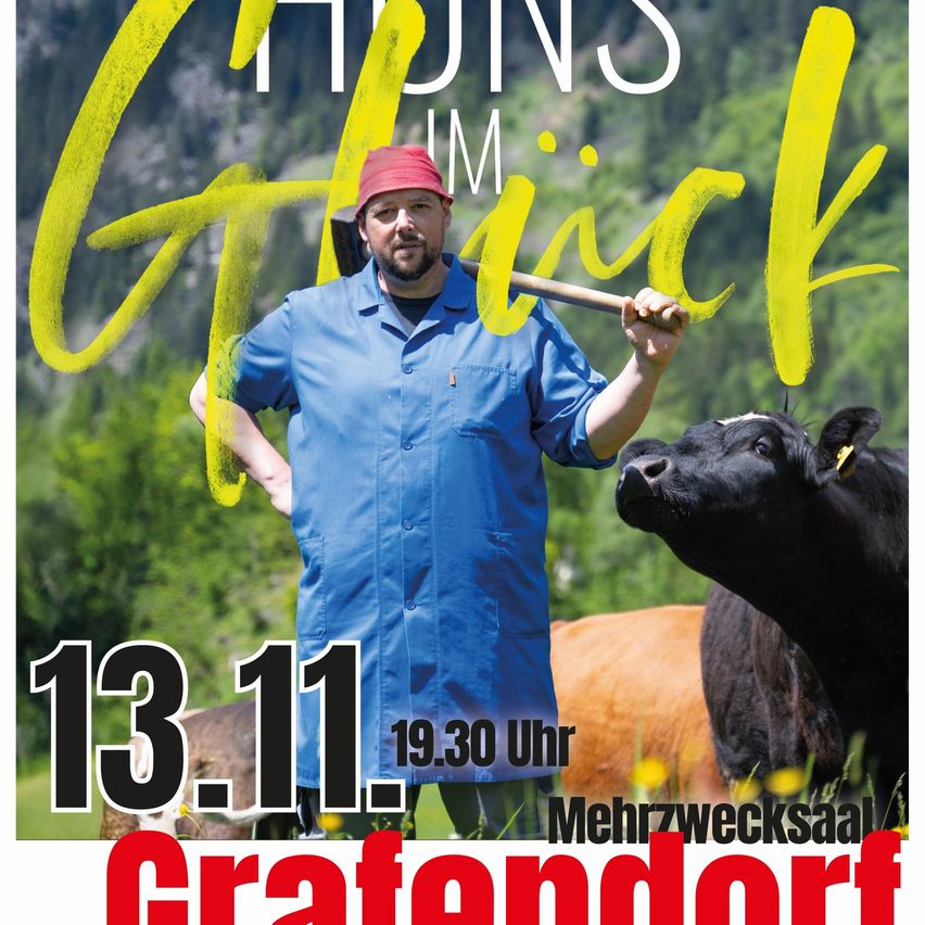 A man in a blue shirt and red hat holds a shovel while standing next to a black cow. The image is for an event on November 13th at 19:30 in Grafendorf.