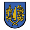 Das Bild zeigt ein schildförmiges Emblem mit blauem Hintergrund. Es enthält Weizenähren und ein goldenes Blattdesign.
