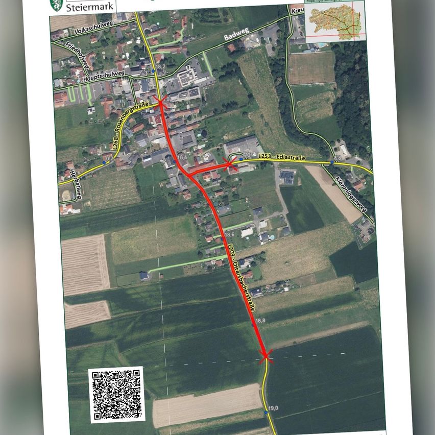 A map showing a village with a red line marking a route, labeled with road numbers and names, and a QR code at the bottom.