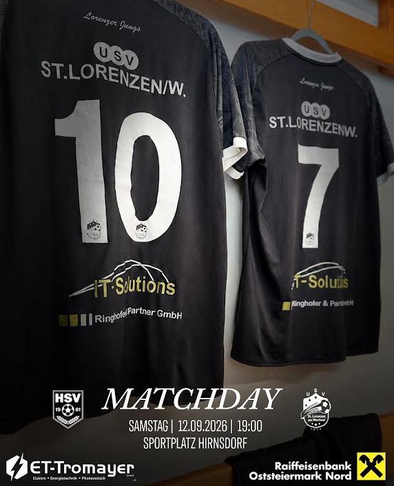 Two black jerseys with numbers 10 and 7, hanging on a wall, with logos and text related to a sports event.