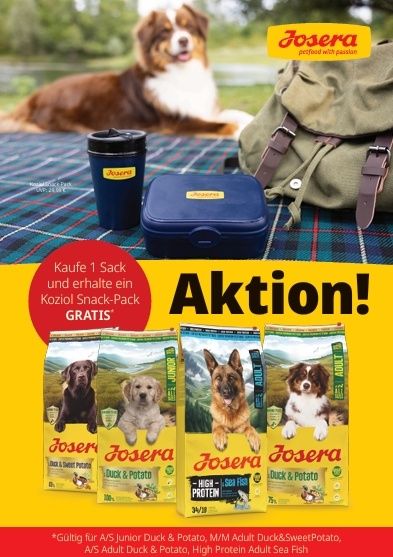 Werbung für Josera Tierfutter, mit einem Hund, Taschen und einer Lunchbox. Die Aktion lautet 'Kaufe 1 Sack und erhalte einen kostenlosen Snack-Pack'. Drei Säcke Hundefutter sind zu sehen, zusammen mit dem Josera-Logo.