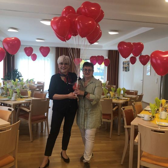 Image contains, Dining Room, Dining Table, Table, People, Person, Balloon, Interior Design, Adult, Male, Man