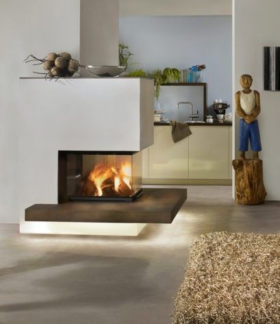 A modern fireplace with a fire lit inside, placed in a contemporary room with white walls and a wooden floor.